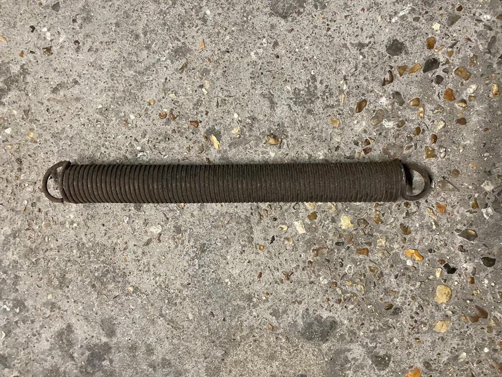 Ressort de traction de porte de garage avant remplacement